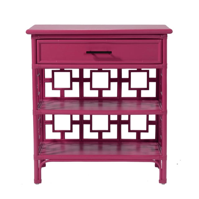 Classically styled, this end table features a Rattan frame with rawhide bindings. The intricate rattan detail is hand...