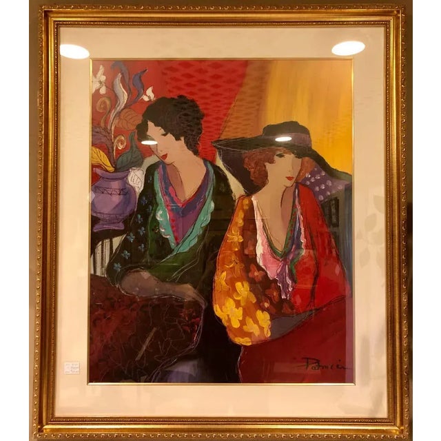 Lithograph by Patricia Govezensky of Two Sophisticated Woman in a vibrant city setting. Gilt framed. EXX.