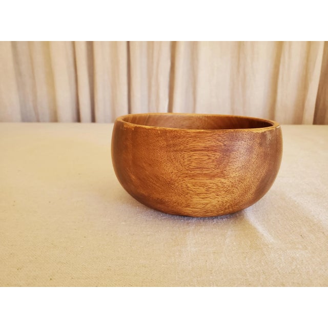 This is a lovely little wood bowl. The bottom is stamped "Pacific Merchants Acaciaware" indicating that it was most likely...