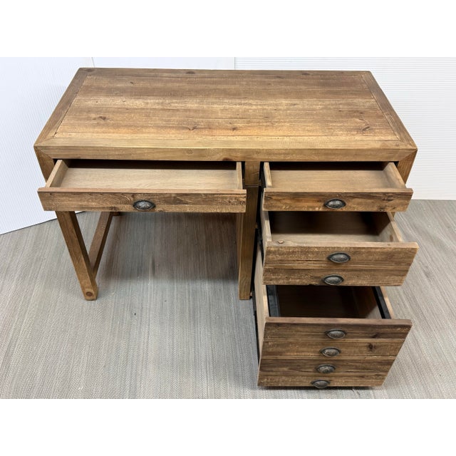 The RH Printmaker's Desk is a popular, rustic home office desk inspired by traditional architectural flat files used to...