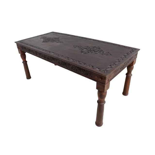 Very rarely and very massively worked oriental table from Afghanistan. Solid wood handcrafted and hand carved. This unique...