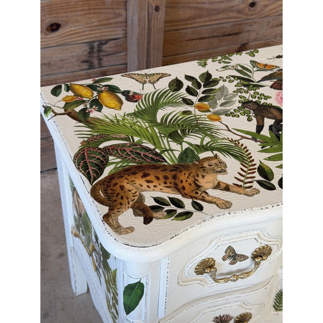 A beautifully reimagined vintage Baker Furniture chest, custom painted and adorned with vibrant tropical decoupage...