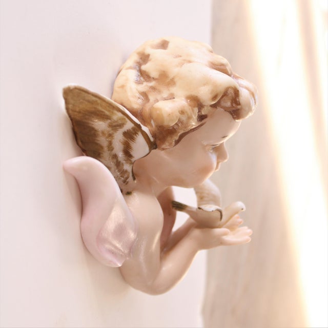Antique European Porcelain hand painted winged Cherub with gold gilt highlights. Elevate your personal Christmas...