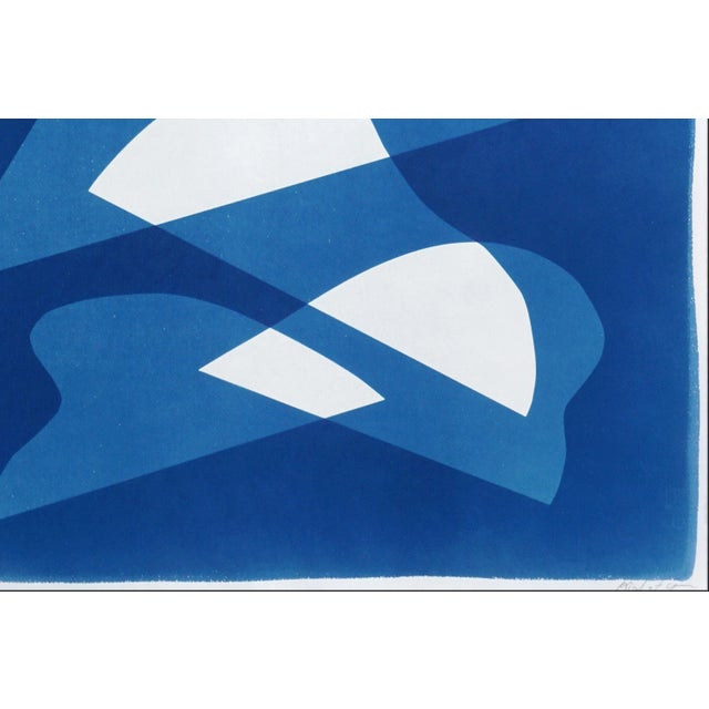 This unique monotype cyanotype, rendered in rich blue tones, draws inspiration from mid-century modern shapes to explore...