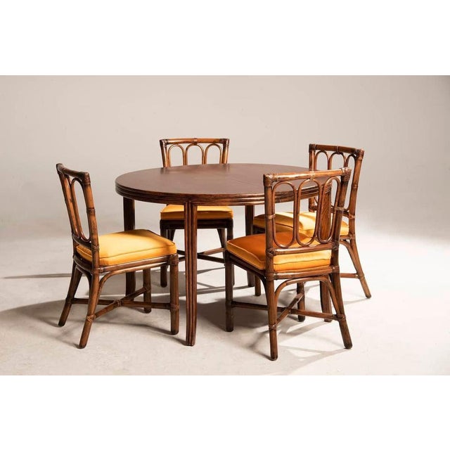 Table in walnut wood by mc guire, 113 cm in size, extendable by 45 cm. The extended table has an oval shape, reaching...