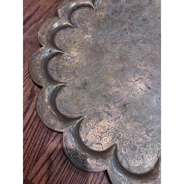 Large vintage or antique hand engraved brass tray, typically of Anglo-Indian or Indo-Persian origin. It features a...