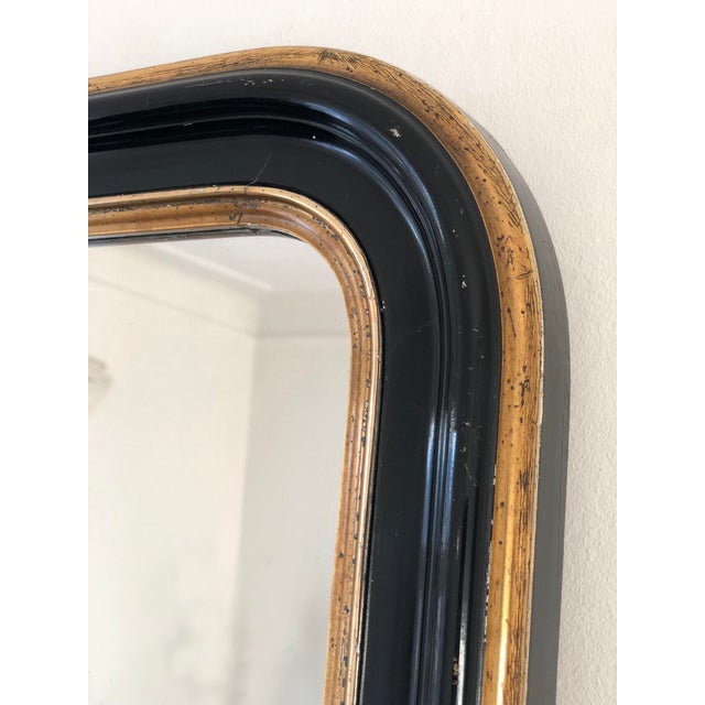 Antique French Louis Philippe small full-length mirror, dating to the late 19th century. The mercury glass mirror features...