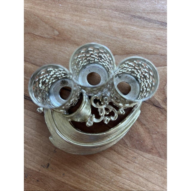 Vintage Stylebuilt (S.F.©) gold-tone filigree triple lipstick holder, circa 1950s–1960s. Features ornate openwork filigree...