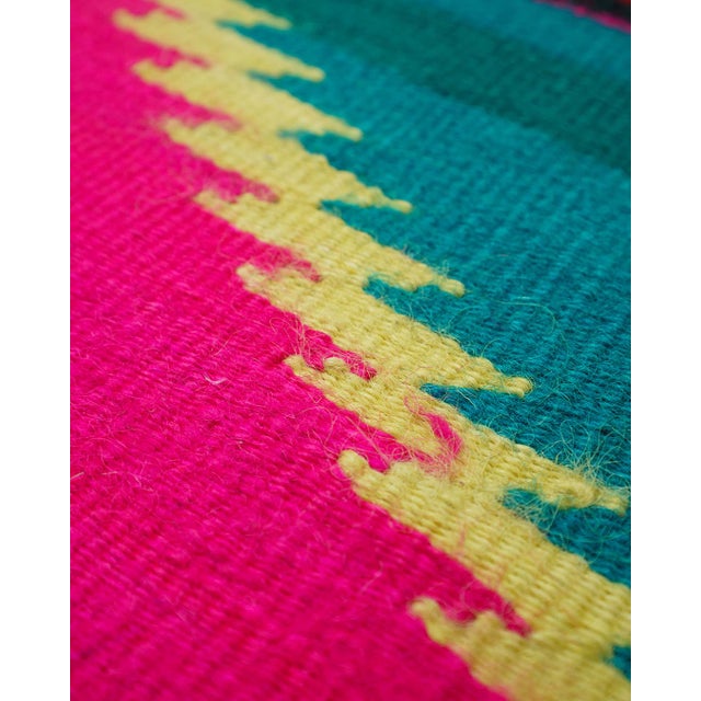 Large vintage handwoven wool flatweave (kilim-style) rug with bold stepped-diamond medallions and graphic striped bands....