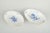 Meissen Two oval serving dishes, mid-20th century. Hand-decorated porcelain with hand-painted blue floral motifs and gilt...