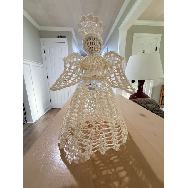 This beautifully hand-crocheted angel tree topper is a charming addition to your holiday décor. Crafted with intricate...