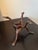 Description A finely carved mid‑20th‑century hardwood serpent tripod stand, crafted from a single block of wood and...