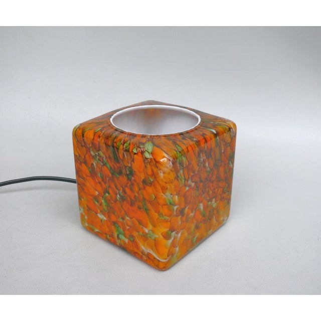 A rare small table lamp, "Cube," manufactured by Peil & Putzler in the 1970s, made of orange, green, black, and beige...