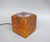 A rare small table lamp, "Cube," manufactured by Peil & Putzler in the 1970s, made of orange, green, black, and beige...
