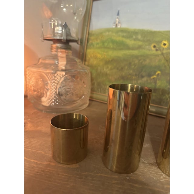 Up for consideration is a beautiful trio of brass cylinder candleholders. These would look lovely in your home and they...