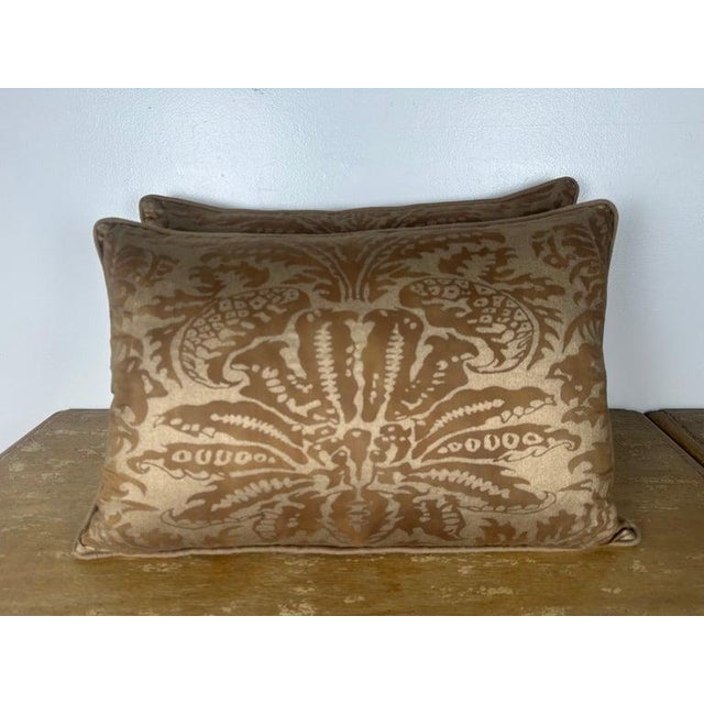 A refined pair of decorative pillows crafted from Fortuny style featuring a richly patterned front with a bold,...