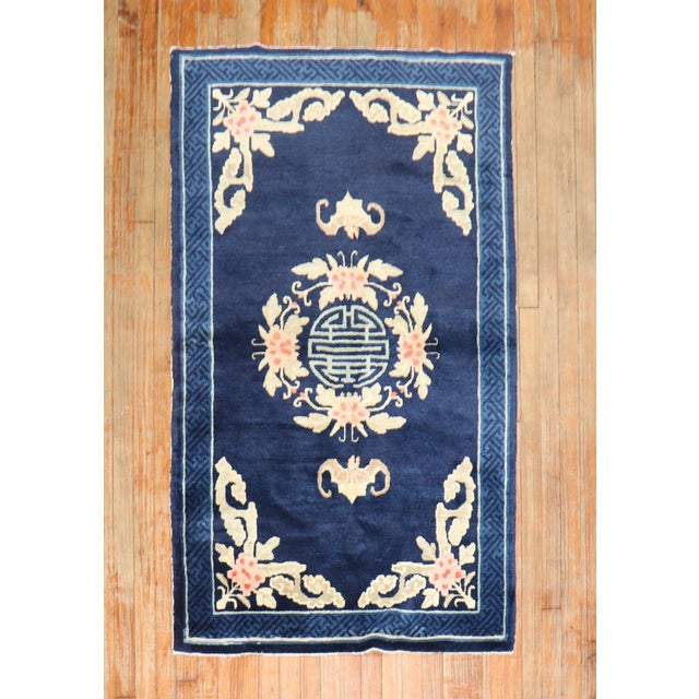 An early 20th-century Chinese Peking scatter size rug Measures: 3'3'' x 5'5''.