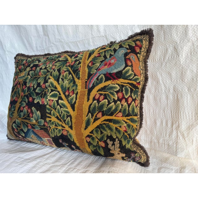 This early 17th century English needlepoint pillow is finely worked in wool and silk and features a richly detailed...