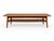 An elegant Danish Modern teak coffee table designed by H.W. Klein for Bramin Møbler, Denmark, circa 1960s. This...