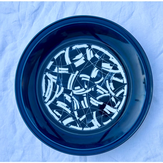 This vintage DANSK stoneware platter features a bold, graphic abstract design in royal blue and white and is part of the...