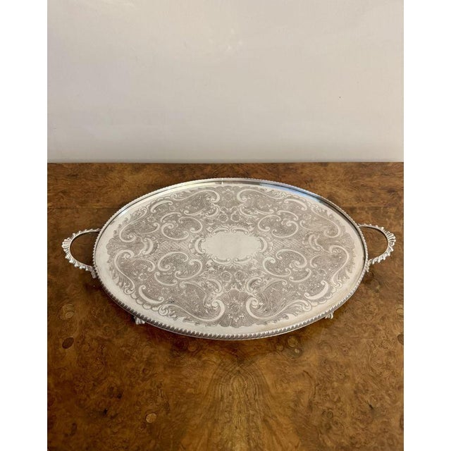 Quality antique Edwardian silver plated oval tea tray having a quality antique Edwardian silver plated tea tray with a...