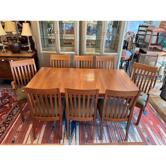 Design Plus Gallery presents an Ethan Allen Solid Cherry Dining Table with Eight Slat-Back Dining Chairs. This coordinated...