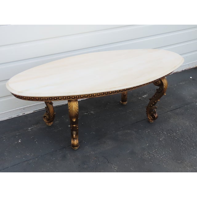 This Coffee Table is made out of metal, wood, and marble. This Coffee Table has French style and design, antique gold...