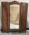 Circa 1920s | Floral Carvings | Adjustable Shelving | Exceptional Figured Walnut An elegant and highly decorative French...