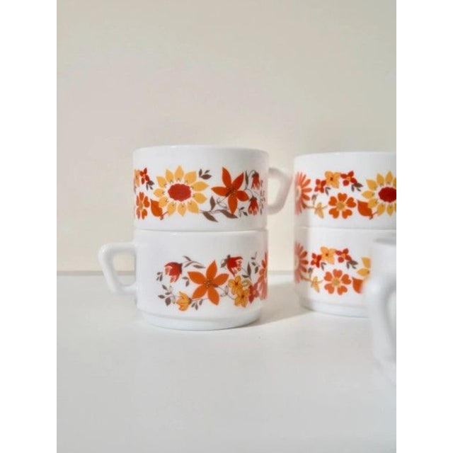 Superb set of ARCOPAL (France) cups from the “Flore” collection, typical of the 70s with its very pop orange floral...