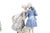 A charming Royal Copenhagen hand-painted porcelain figurine group depicting a Rococo-era courting couple — a gentleman in...