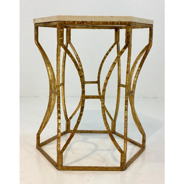 Modern Roja hexagonal marble and iron side table, ribbed frame finished in gold with a beige top, showroom floor sample