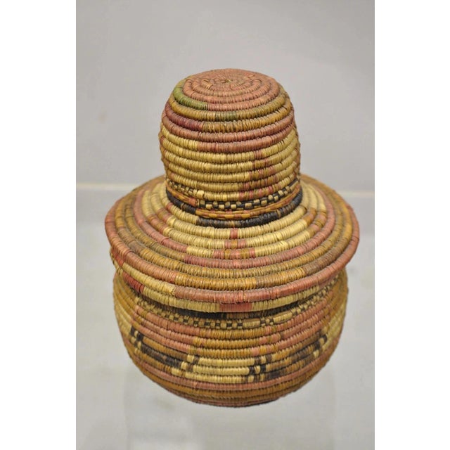Vintage Nigerian African Tribal Hausa Woven Orange Basket with Dome Lid. Circa Mid 20th Century. Measurements: 7.5" H x...