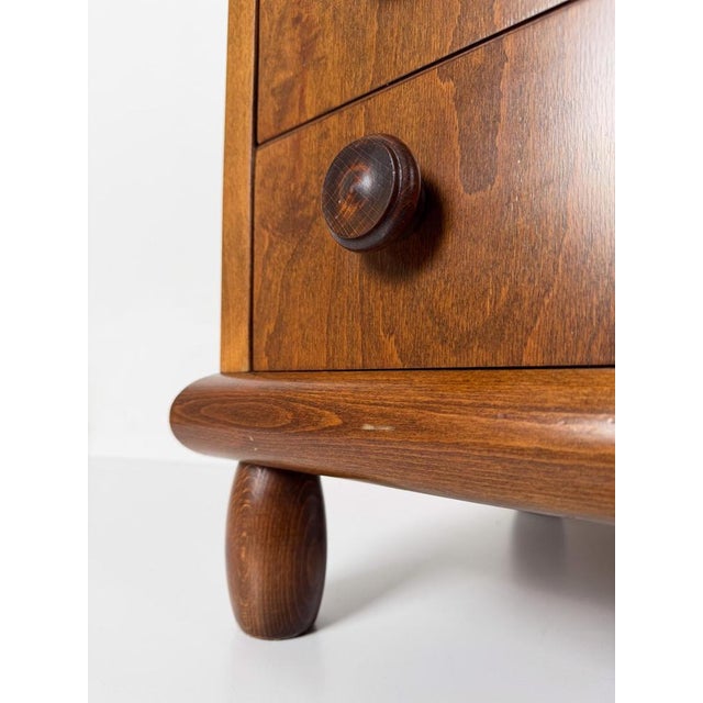 Elegant mid-century modern chest of drawers that celebrates the rustic aesthetic typical of Alpine chalets. Its minimalist...