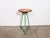Vintage Industrial factory stool made in former Czechoslovakia during the 1960s It features a plywood seat and a green...