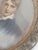 Beautiful mini portrait in double sided frame decorated with gilt bronze filigree and pearls. Back side of frame shows...