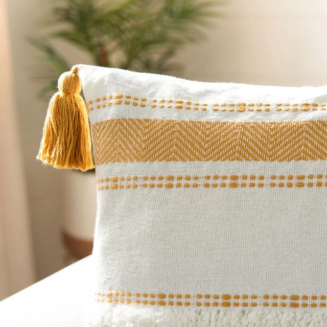 Introducing the Polli Pillow in a warm mustard hue, a perfect addition to your home for both comfort and style. This...