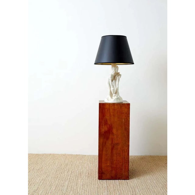 Elegant Van Briggle sculpture depicting "Rebecca at the Well" finished in a creamy matte white glaze. The base has the Van...