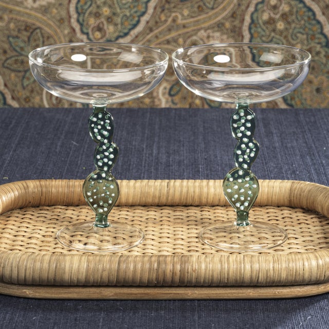 Elevate your cocktail experience with the Climbing Cacti Tequila Cocktail Glasses. Featuring a classic clear-finish coupe...