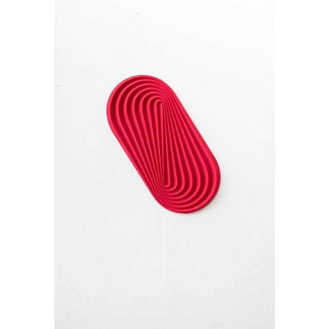 “Ol”, a red shade coloured carved wood wall sculpture by Amsterdam based designer Arno Hoogland. MATERIALS: Pressed wood,...