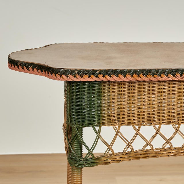 Charming antique wicker table with the trademark paint technique. As seen in the last photo of the listing, a matching...