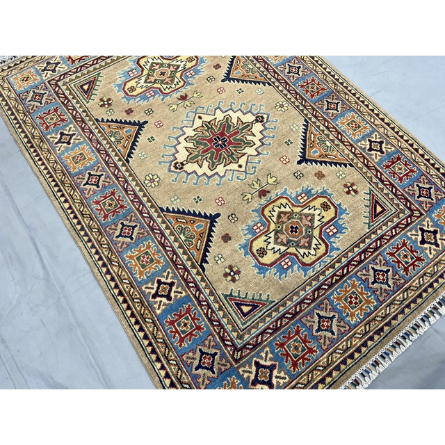 2000 - 2009 Beige Persian Style Kazak Wool Rug With Blue Border, 4'2" X 5'10" For Sale - Image 5 of 14