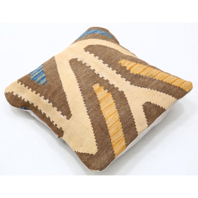 A one-of-a-kind handwoven Afghan wool kilim accent pillow featuring bold branching chevron. Cut and sewn by hand from a...