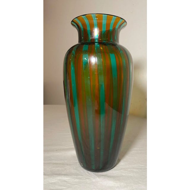 This vintage Veart Venezia vase is a beautiful piece of Italian art glass. The hand blown caned glass is crafted with...