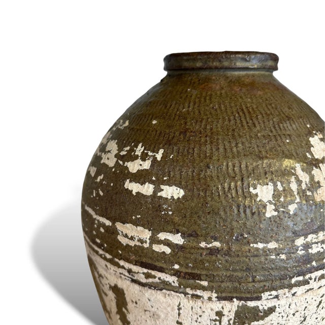 Bring the sun-drenched landscapes of rural Turkey into your home with this vintage ceramic vase. Handcrafted by skilled...