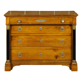 Early 19th Century French Empire Fruitwood Four-Drawer Commode with Ebonized Corinthian Columns For Sale