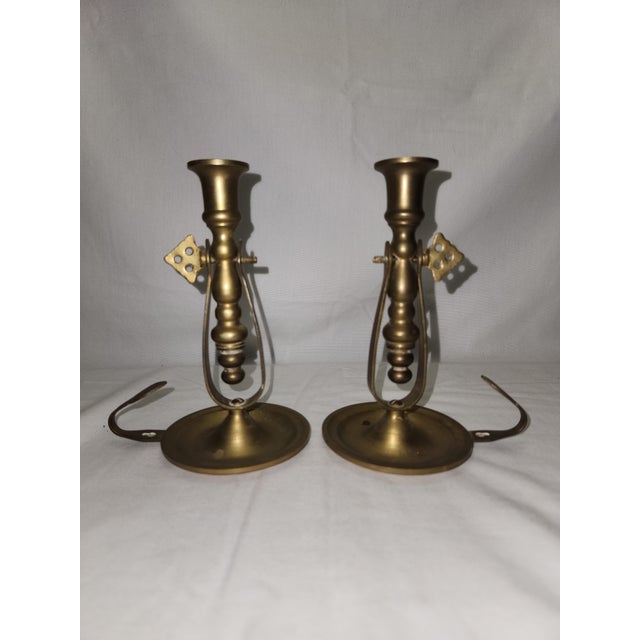 Pair of vintage Interior brass candlestick holders, perfect for adding a touch of classic elegance to any room. These...