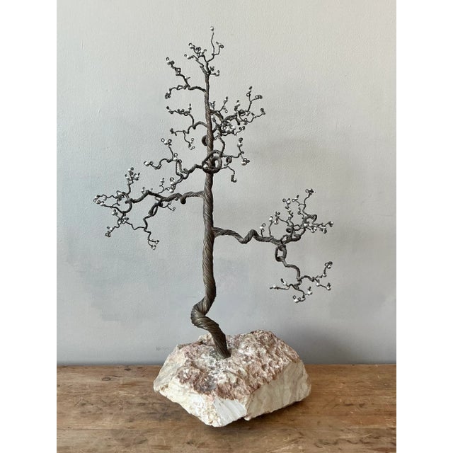 Presenting a mesmerizing vintage Boho twisted metal tree sculpture, a unique piece of artistry that blends natural forms...