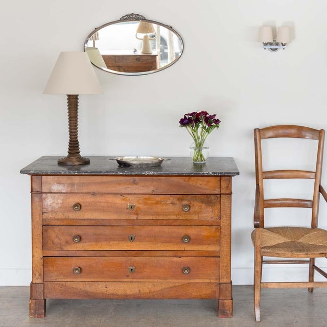 Lovely carved oak and marble dresser from France, 1940s. Beautiful original dark grey marble top with three drawers and...