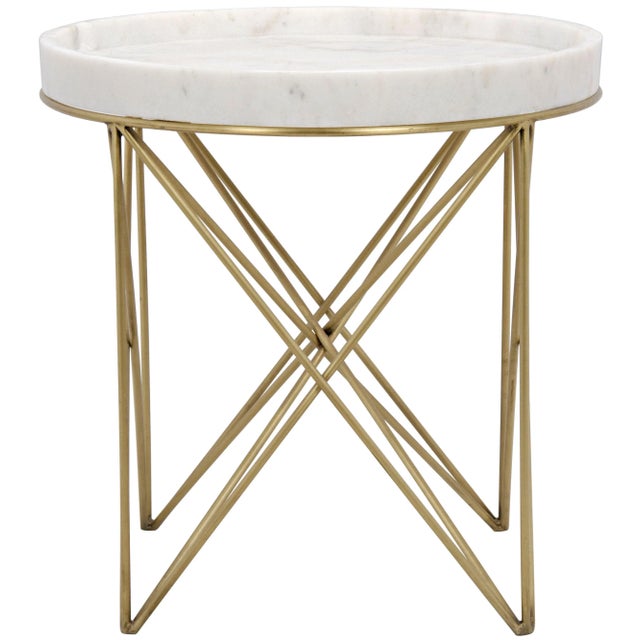 Slim, seemingly delicate bands of metal gracefully support a marble top in this lovely table. The metal is given a softly...