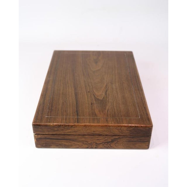 Rosewood storage box with KFK logo (1922-1971). Interior compartmentalization – perfect for small items. Material:...